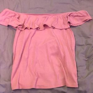 Light rose pink, off the shoulder top and ruffles around the top.